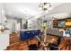 Bright open concept kitchen with large island and modern finishes, including hardwood flooring at 20403 Walnut Grove Ln, Tampa, FL 33647