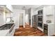 Spacious kitchen features stainless steel appliances, pantry and hardwood floors at 20403 Walnut Grove Ln, Tampa, FL 33647