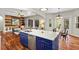 Open kitchen with a large island and seating area, overlooking the living room at 20403 Walnut Grove Ln, Tampa, FL 33647