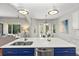 Close-up of kitchen island with stainless steel sink and dishwasher with view to outdoor living space at 20403 Walnut Grove Ln, Tampa, FL 33647