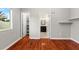Bright main bedroom with hardwood floors, natural light, and ensuite bathroom access at 20403 Walnut Grove Ln, Tampa, FL 33647