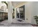 View of covered back patio with brick pavers leading into home at 2410 W North A St # 2, Tampa, FL 33609