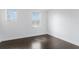 The space features wood-look flooring, two windows, and is painted in a light neutral color at 2410 W North A St # 2, Tampa, FL 33609