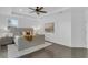 Bright bedroom with a ceiling fan, wood floors, a tray ceiling and neutral decor at 2410 W North A St # 2, Tampa, FL 33609