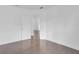 This bedroom has an entrance to another room, wood-look flooring, and neutral wall paint at 2410 W North A St # 2, Tampa, FL 33609