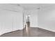 This bedroom has wood-look flooring, an entrance to another room, and a double door closet at 2410 W North A St # 2, Tampa, FL 33609