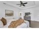Bright bedroom features tray ceilings, dark wood floors, ceiling fan, ensuite access and natural light at 2410 W North A St # 2, Tampa, FL 33609