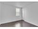 Bright bedroom features neutral paint, wood-look flooring, and natural light from a window at 2410 W North A St # 2, Tampa, FL 33609