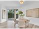 Dining room features natural light, neutral colors, and backyard access at 2410 W North A St # 2, Tampa, FL 33609