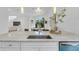 Gourmet kitchen with modern appliances, marble countertops, island, hardwood floors, and contemporary lighting at 2410 W North A St # 2, Tampa, FL 33609