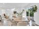 Cozy living room area with views of dining space, back yard, hardwood floors, and neutral color palette at 2410 W North A St # 2, Tampa, FL 33609