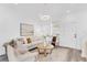 Bright living room with lots of light features modern décor, hardwood floors, contemporary lighting, and neutral colors at 2410 W North A St # 2, Tampa, FL 33609