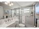 Clean, bright bathroom featuring a glass-enclosed shower, and updated fixtures at 2960 59Th S St # 615, Gulfport, FL 33707