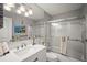 Clean bathroom featuring a modern sink, fixtures, tile, and glass shower doors at 2960 59Th S St # 615, Gulfport, FL 33707