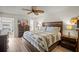 Comfortable bedroom featuring a wooden bed frame, ceiling fan, and modern decor at 2960 59Th S St # 615, Gulfport, FL 33707