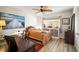 Bright bedroom with ceiling fan, decor, light wood floors, and accents throughout at 2960 59Th S St # 615, Gulfport, FL 33707