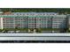 Multi-story condominium complex featuring lush landscaping and covered parking at 2960 59Th S St # 615, Gulfport, FL 33707