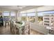 Bright dining room featuring a wooden table with chairs and views of the surrounding community at 2960 59Th S St # 615, Gulfport, FL 33707