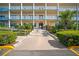 Multi-story building with lush landscaping and access ramp in a friendly community at 2960 59Th S St # 615, Gulfport, FL 33707