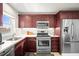 Corner kitchen with stainless steel appliances and white countertops at 2960 59Th S St # 615, Gulfport, FL 33707