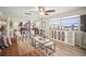 Cozy living room with laminate floors, a leather couch, and view of the kitchen at 2960 59Th S St # 615, Gulfport, FL 33707