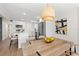 Eat-in kitchen adjacent to dining area with modern light fixture and stainless appliances at 3066 Highland N St, St Petersburg, FL 33704