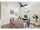 A well-lit home office featuring a desk, comfortable chairs, and a leafy green plant at 3066 Highland N St, St Petersburg, FL 33704