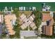 Aerial view of condo complex with lush landscaping, parking, and serene residential living at 311 Island Way # 101, Clearwater Beach, FL 33767