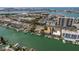 An aerial view of a waterfront community with condos and boats docked along the canal at 311 Island Way # 101, Clearwater Beach, FL 33767