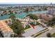Aerial view of waterfront condos with boat docks and serene views of the Intracoastal Waterway at 311 Island Way # 101, Clearwater Beach, FL 33767