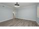 Neutral paint and gray floors create a blank slate in this spacious bedroom at 311 Island Way # 101, Clearwater Beach, FL 33767
