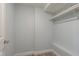 Walk in closet with clothing rack and bench at 311 Island Way # 101, Clearwater Beach, FL 33767