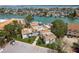 Aerial view of a condo complex with a parking lot and waterfront boat slips at 311 Island Way # 101, Clearwater Beach, FL 33767