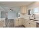 Updated kitchen offers white cabinets, modern appliances, and connects to the spacious living area at 311 Island Way # 101, Clearwater Beach, FL 33767