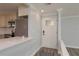Bright kitchen area featuring a breakfast bar, stainless steel appliances and stylish cabinets at 311 Island Way # 101, Clearwater Beach, FL 33767