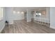 Spacious living room showcases new flooring and neutral tones, flowing into kitchen space at 311 Island Way # 101, Clearwater Beach, FL 33767