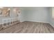 Open living room featuring modern flooring, neutral paint, and access to the kitchen at 311 Island Way # 101, Clearwater Beach, FL 33767