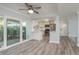 Bright living space offers modern finishes, view to patio, and access to updated kitchen at 311 Island Way # 101, Clearwater Beach, FL 33767