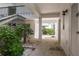 Clean, airy passageway with tile flooring and access to storage at 311 Island Way # 101, Clearwater Beach, FL 33767