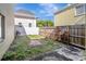 Cozy backyard with partial grass, concrete patio, and partial wooden fence at 3206 W Azeele St # 126, Tampa, FL 33609
