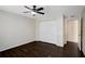 Bedroom with hardwood flooring, and closet with paneled doors at 3206 W Azeele St # 126, Tampa, FL 33609