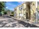 Condominium exterior shows the entry stairs to the units, and tidy landscaping at 3206 W Azeele St # 126, Tampa, FL 33609