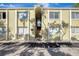 Inviting condo complex with stucco facade, trimmed windows and stairs leading to the upper units at 3206 W Azeele St # 126, Tampa, FL 33609