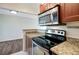 Modern kitchen features stainless steel appliances and granite countertops at 3206 W Azeele St # 126, Tampa, FL 33609