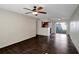 Open-concept living room with hardwood floors flowing into the kitchen and patio doors at 3206 W Azeele St # 126, Tampa, FL 33609