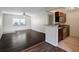 Inviting living room featuring dark hardwood flooring and bright natural lighting at 3206 W Azeele St # 126, Tampa, FL 33609