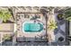 A tranquil courtyard pool is surrounded by sun loungers and lush, tropical landscaping at 3206 W Azeele St # 126, Tampa, FL 33609