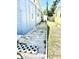 Backyard featuring a stone path, gravel and grass, and block pavers at 3318 Boca Ciega N Dr, St Petersburg, FL 33710