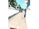 The backyard features a white fence and a small storage shed at 3318 Boca Ciega N Dr, St Petersburg, FL 33710