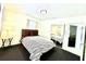 Cozy bedroom with neutral walls, carpet flooring, a mirrored closet, and ceiling fan at 3318 Boca Ciega N Dr, St Petersburg, FL 33710
